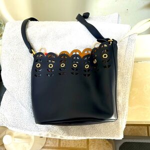 Navy bucket bag Got it at a jewelry show  Love it but rarely use it